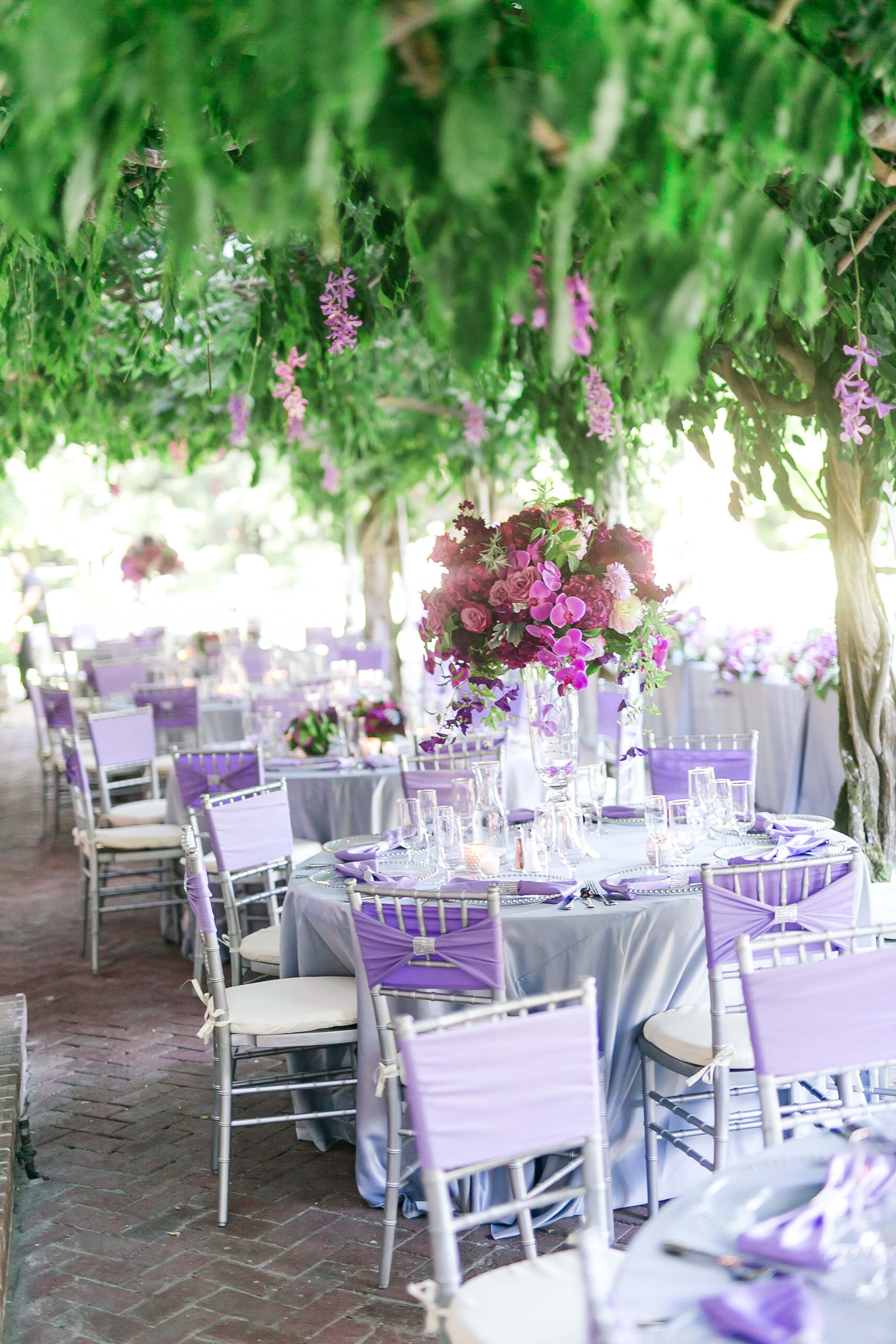 ballroom wedding reception featuring a 14′ white floral