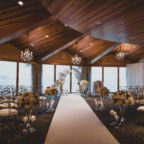 Flora Nova Design Seattle - Luxurious Winter Wedding at the Edgewater Hotel. White and Grey Ceremony Arch with Phalaenopsis Orchids
