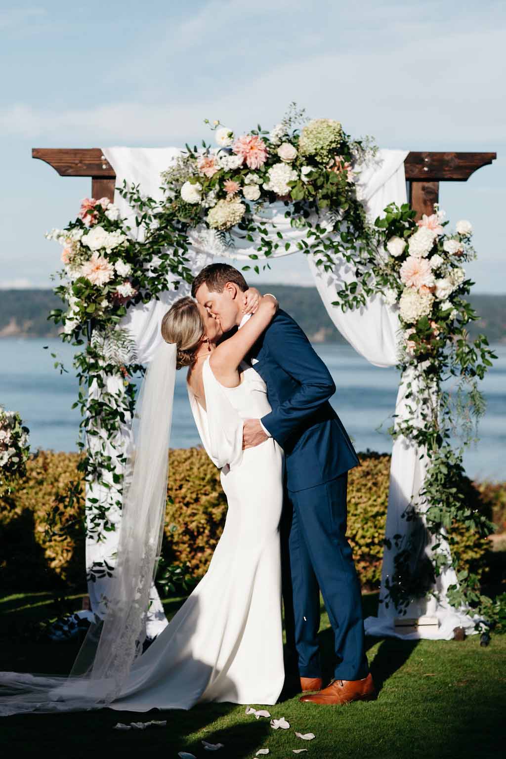 Wooden wedding arbor with drapes, greenery, and blush flowers - Elegant Seattle Garden Wedding by Flora Nova Design Seattle