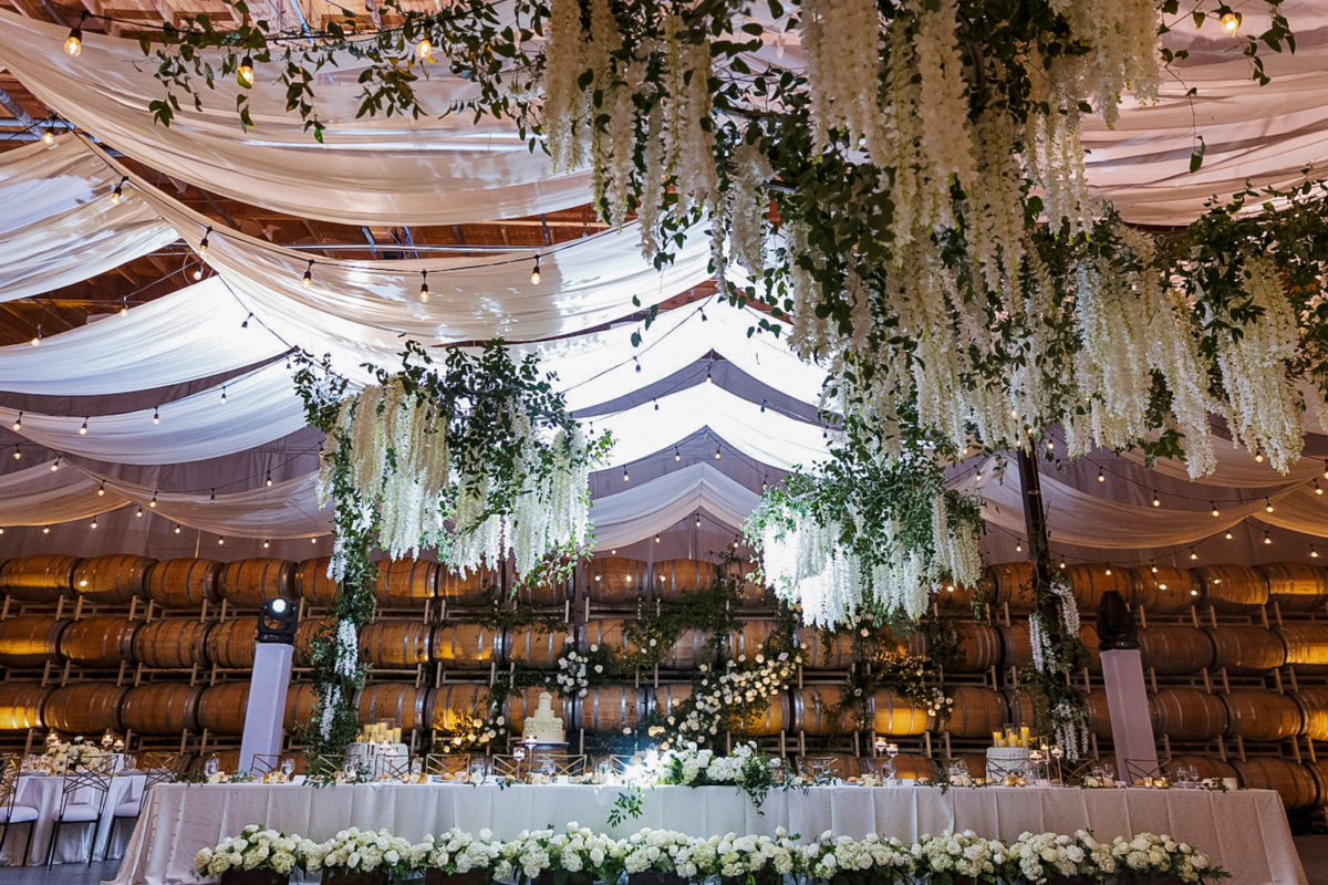 Columbia Winery ceiling is designed by Seattle florist with ceiling installations of wisteria, making it resemble a floral sky.