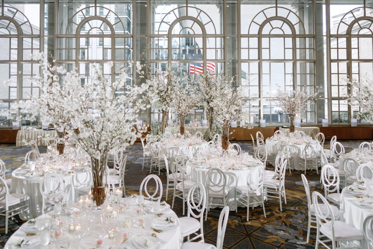 Lovely reception the Garden Room is designed with Fairytale Cherry Blossom Garden arrangements.