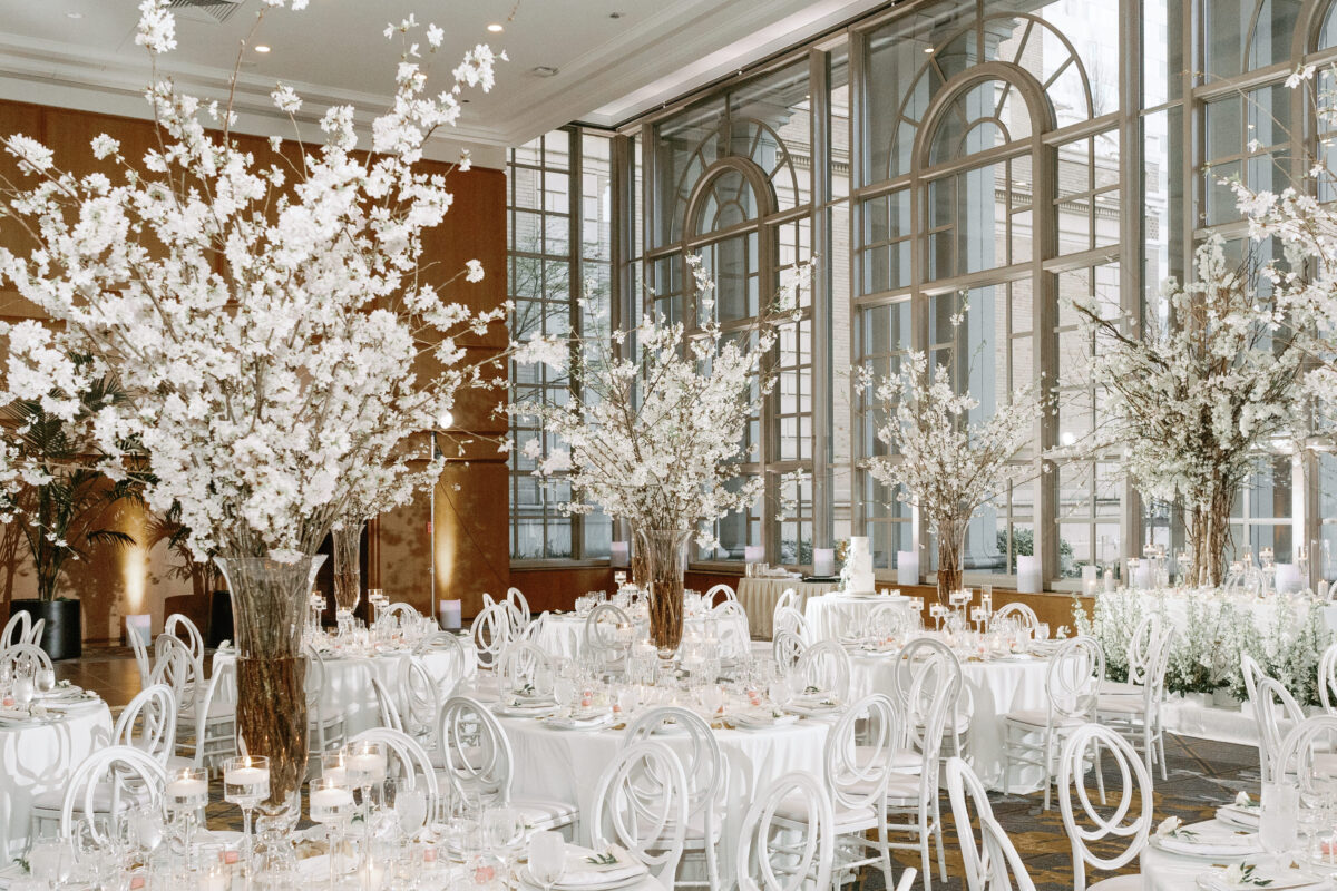 A Fairytale Cherry Blossom Garden reception designed by Seattle florist Flora Nova Design takes place in the Garden room at Fairmont Olympic Hotel