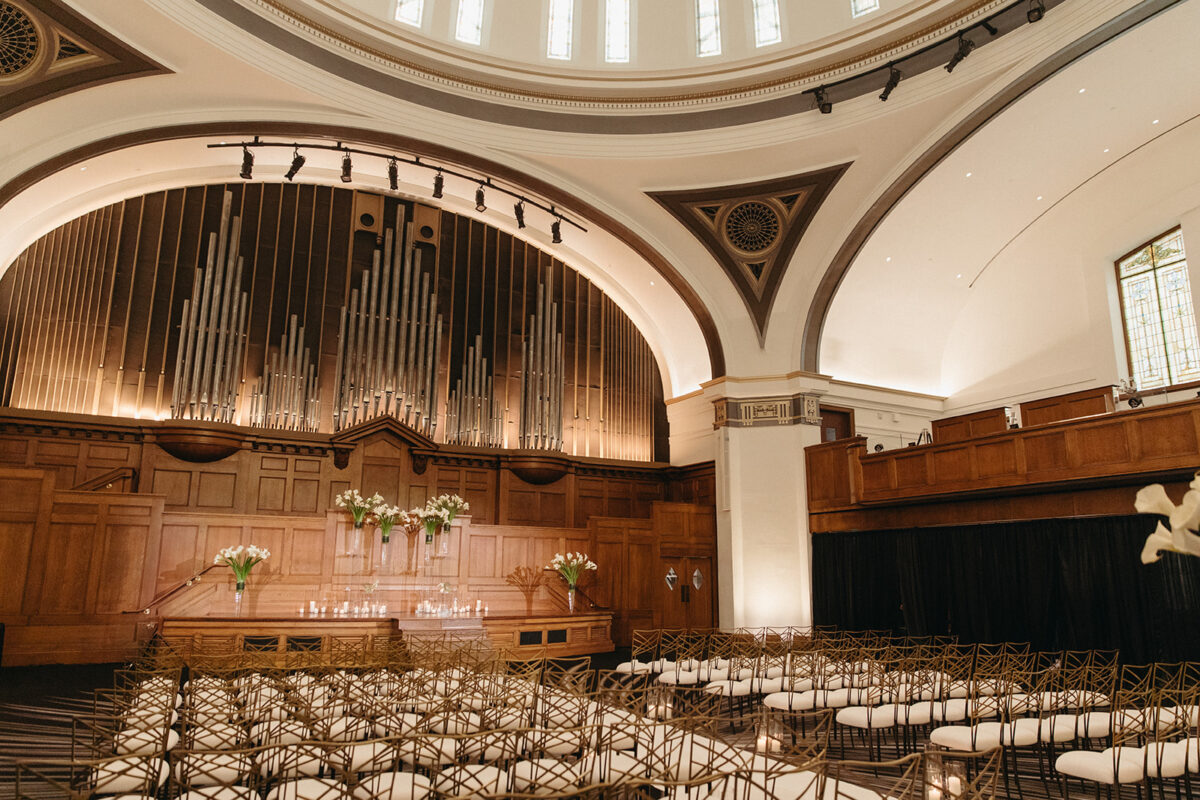 Wide view of Elegant Hotel Lotte Wedding ceremony space with domed ceiling and ornate pipe organ