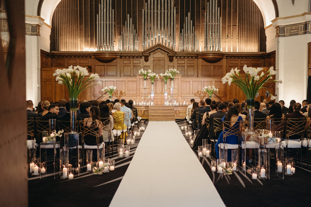 Full ceremony setup at Elegant Hotel Lotte Wedding with white aisle runner and candlelit seating