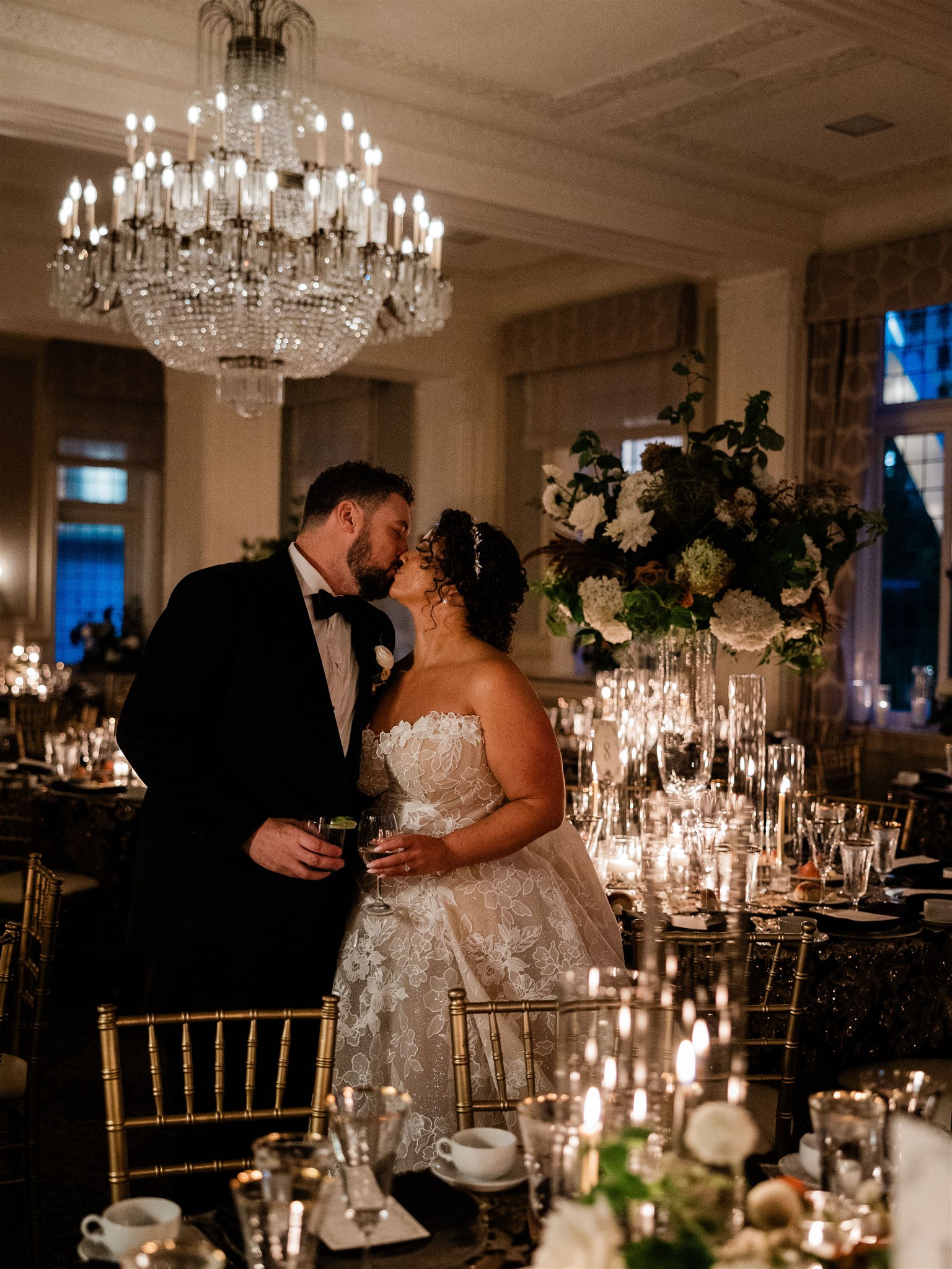 Romantic Wedding at Rainier Club Seattle by Flora Nova Design bride and groom in front of candlelit reception guest table.
