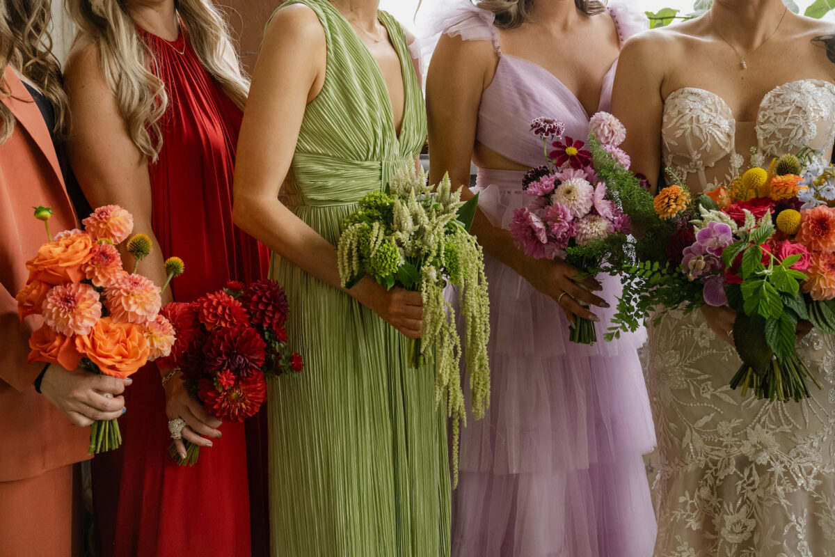 Monochromatic bridesmaid bouquets matching back to each of the bridesmaids dresses. The bouquets colors were all represented in the bridal bouquet.