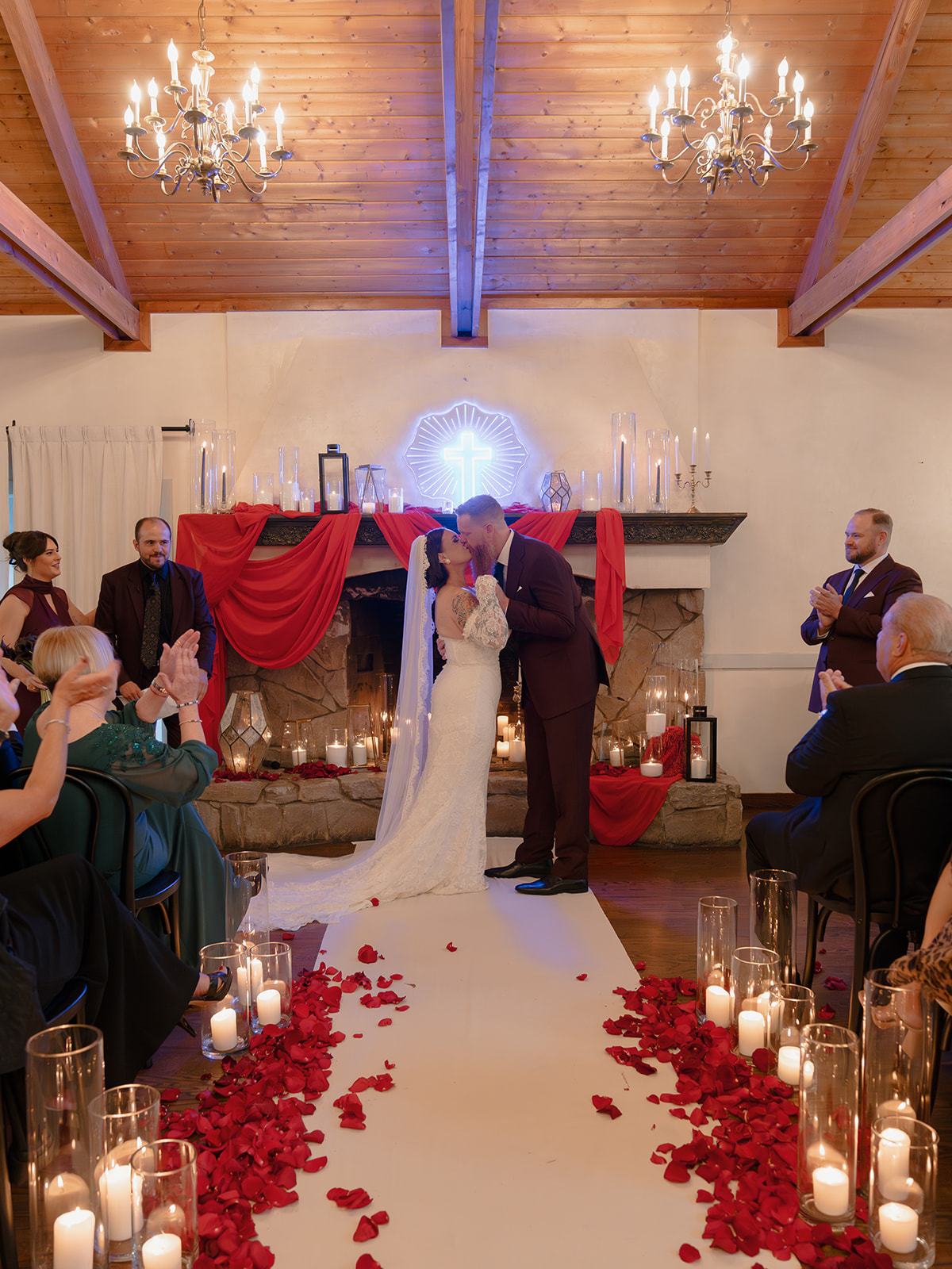 Romance at the red draped fireplace altar.
