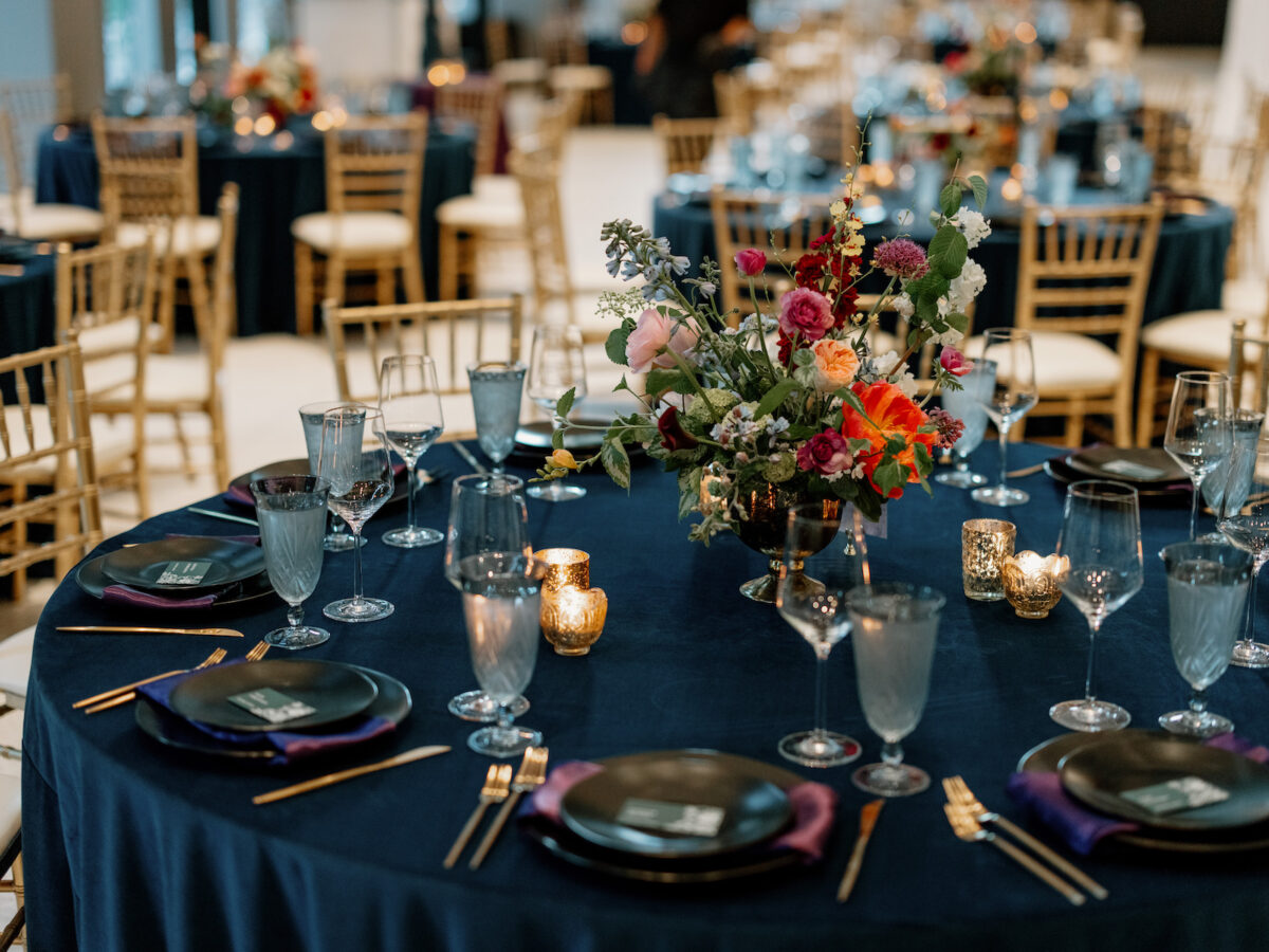Compote style centerpiece and romantic gold mercury glass candlelight.